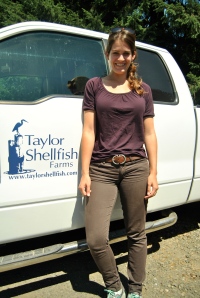 Road tripper Allie Goldstein poses next to a Taylor Shellfish truck