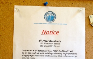 A notice in a New York City building informs residents of their soon-to-be cool roof